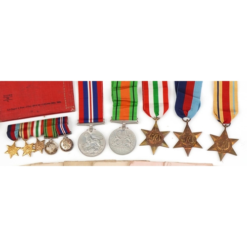 1219 - British military World War II medal group relating to the Davis family including medals with boxes o... 