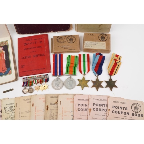 1219 - British military World War II medal group relating to the Davis family including medals with boxes o... 