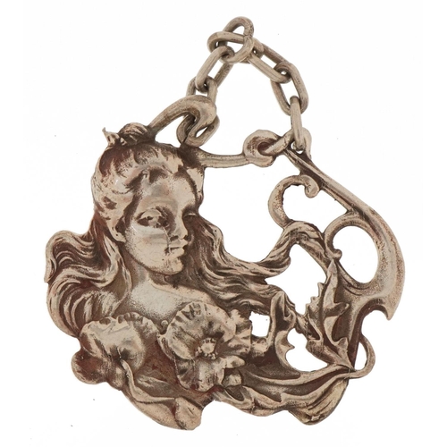 3222 - Art Nouveau unmarked silver pendant embossed with a female and flowers, 5.5cm wide, 23.8g