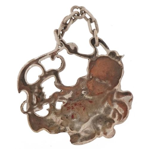 3222 - Art Nouveau unmarked silver pendant embossed with a female and flowers, 5.5cm wide, 23.8g