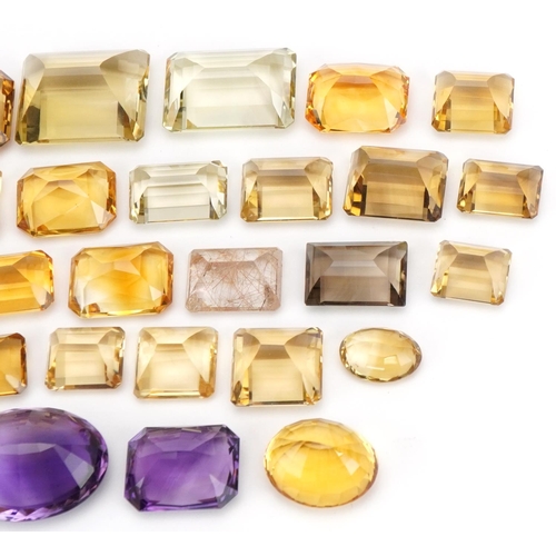 3823 - Loose semi precious stones including citrine, smoky quartz and amethyst, the largest 3cm in length