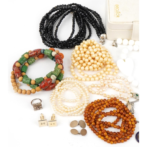 3829 - Vintage and later costume jewellery including simulated pearl necklaces, jet style necklaces, enamel... 