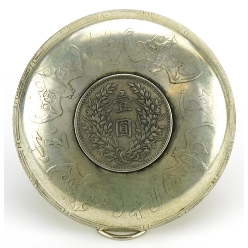 206 - Chinese white metal dragon dish inset with a coin, 9.5cm in diameter