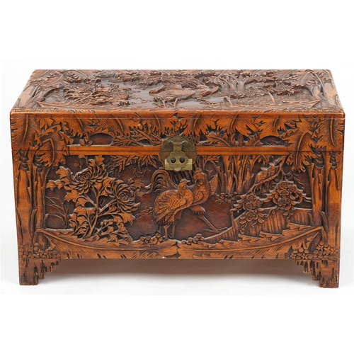 1003 - Good Chinese camphor wood trunk finely carved with cockerels amongst bamboo grove, peony blossom and... 