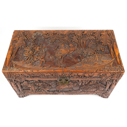 1003 - Good Chinese camphor wood trunk finely carved with cockerels amongst bamboo grove, peony blossom and... 