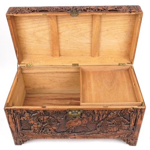 1003 - Good Chinese camphor wood trunk finely carved with cockerels amongst bamboo grove, peony blossom and... 