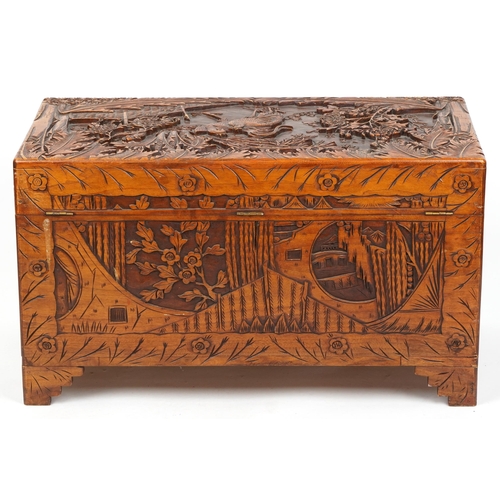 1003 - Good Chinese camphor wood trunk finely carved with cockerels amongst bamboo grove, peony blossom and... 