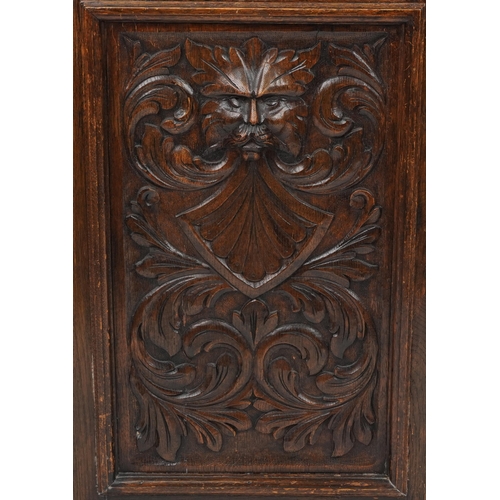 1019 - Victorian oak sideboard fitted with two frieze drawers above cupboard base carved with masks amongst... 