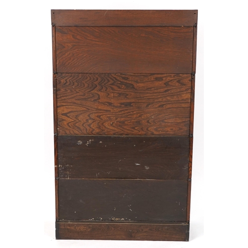 1011 - 19th/20th century Globe Wernicke oak four section bookcase on stand with fall enclosing pigeon holes... 