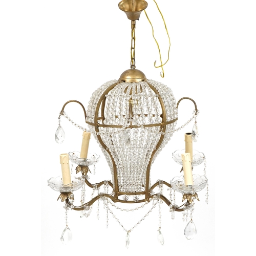 1033 - Ornate gilt metal and glass four branch chandelier with four girondelles and drops, overall 88cm hig... 