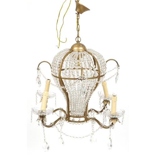 1033 - Ornate gilt metal and glass four branch chandelier with four girondelles and drops, overall 88cm hig... 