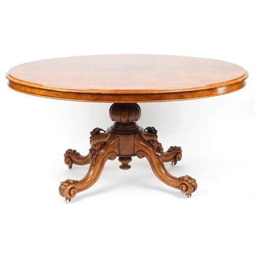 1007 - Victorian burr walnut loo table with quarter veneered top and floral carved knees and feet, 74cm H x... 