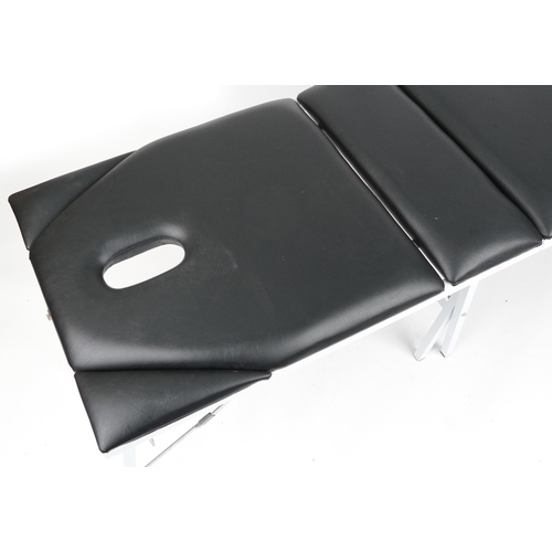 1018 - Travelling folding massage table with black leatherette upholstery, 74cm H x 185cm W x 62cm D