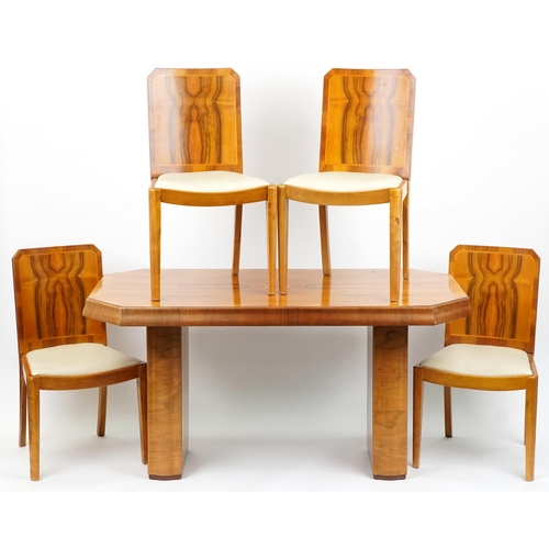 1001 - Art Deco walnut twin pedestal dining table and four chairs with cream leatherette upholstered seats,... 