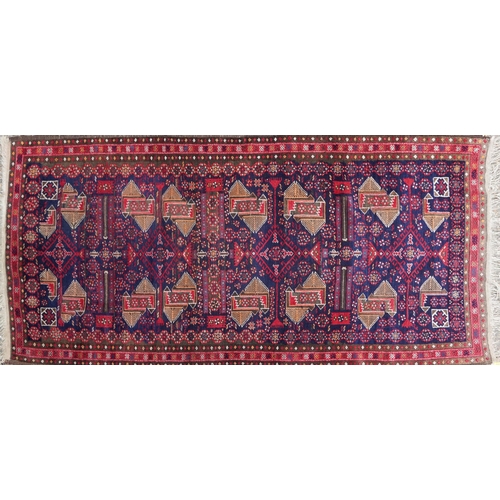 1025 - Rectangular Persian rug having an allover repeat geometric design, 230cm x 110cm