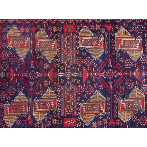 1025 - Rectangular Persian rug having an allover repeat geometric design, 230cm x 110cm