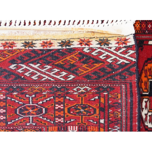 1010 - Rectangular Persian red ground rug having an allover repeat design, 170cm x 120cm