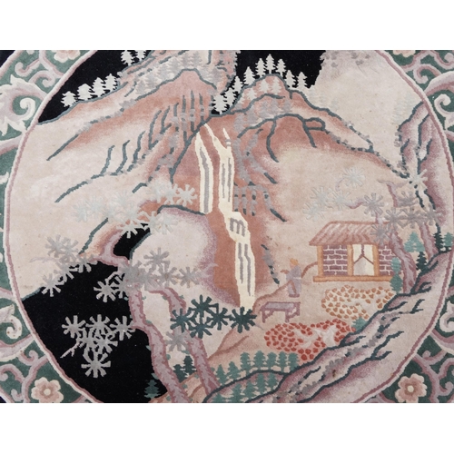 1035 - Circular Chinese rug decorated with a figure beside water, 160cm in diameter