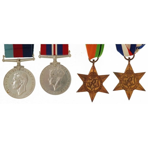 1222 - Four British military World War II medals with box of issue inscribed B G Chaplain