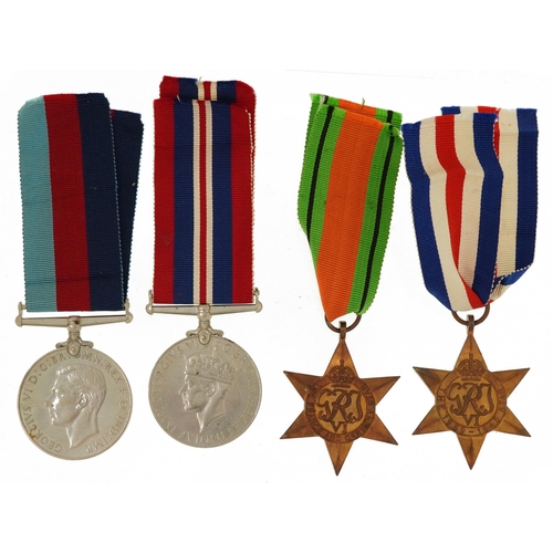 1222 - Four British military World War II medals with box of issue inscribed B G Chaplain