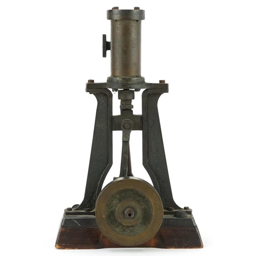 334 - Early 20th century steam interest piston on wooden block base, 18.5cm wide