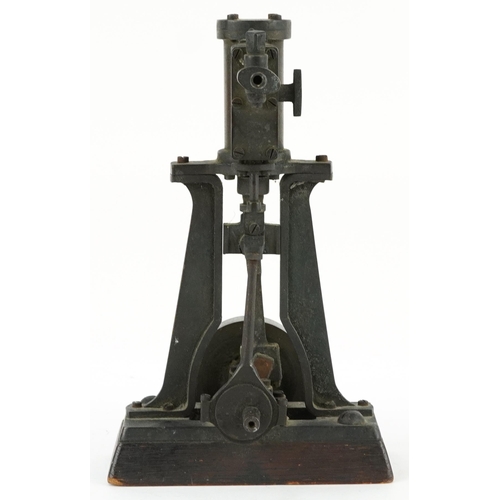 334 - Early 20th century steam interest piston on wooden block base, 18.5cm wide