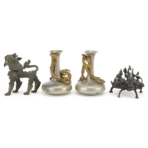 207 - Indian and Asian metalware including a pair of pewter vases surmounted with dragons, the largest eac... 