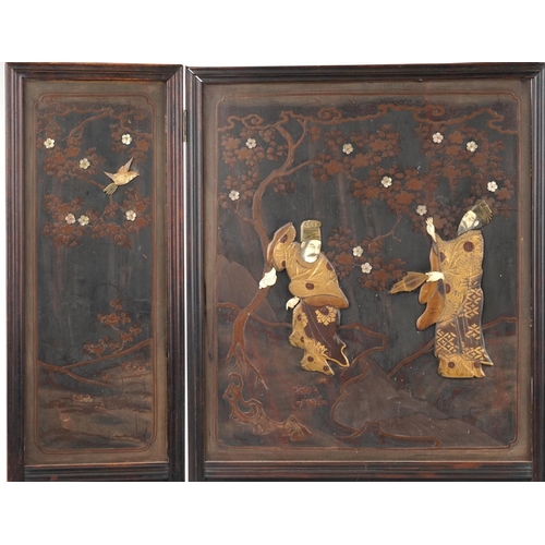 133 - Japanese hardwood and lacquered three fold screen with bone inlay, decorated in relief with two figu... 