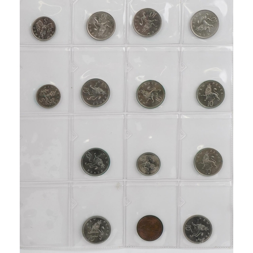 686 - Elizabeth II British coinage arranged in a folder, predominantly uncirculated, including five pence,... 