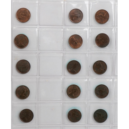 686 - Elizabeth II British coinage arranged in a folder, predominantly uncirculated, including five pence,... 