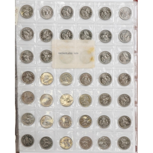 686 - Elizabeth II British coinage arranged in a folder, predominantly uncirculated, including five pence,... 