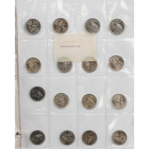 686 - Elizabeth II British coinage arranged in a folder, predominantly uncirculated, including five pence,... 