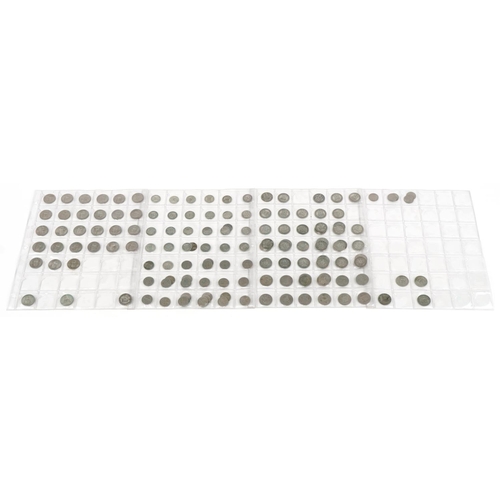 769 - British coinage arranged on four sheets, some pre 1947 including shillings and sixpences