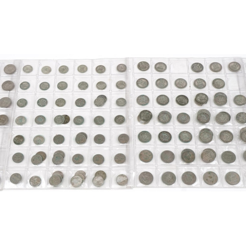 769 - British coinage arranged on four sheets, some pre 1947 including shillings and sixpences