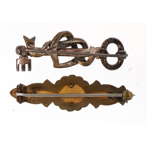 3201 - Silver marcasite key brooch and Victorian unmarked gold aesthetic bar brooch housed in a Chas. Frank... 