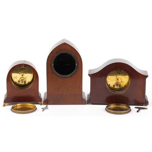 8 - Three Edwardian inlaid mahogany mantle clocks with enamelled dials, the largest 26cm high