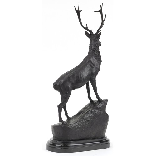 169 - After Joules Moigniez, large patinated bronze stag raised on oval marble base, 74cm high