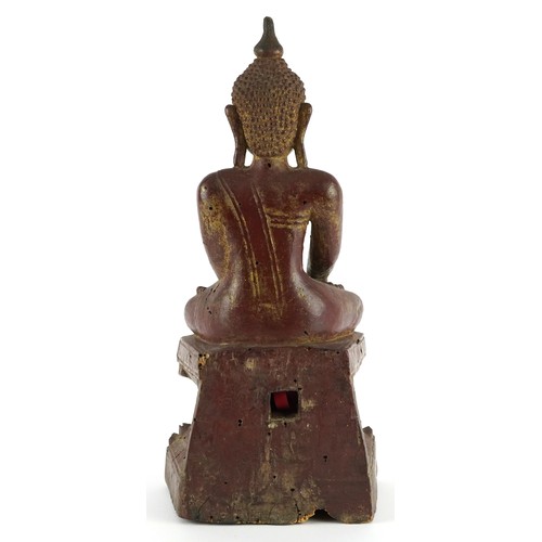 314 - Antique Burmese red and gilt lacquered wood carving of buddha, 29cm high