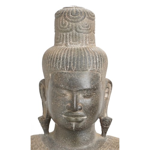 418 - Large Cambodian Khmer Empire stone deity finely carved with robe, on later stand, the carving 132cm ... 