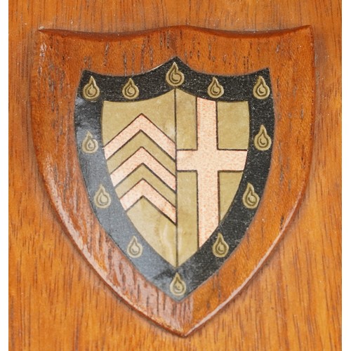 850 - Pair of rowing interest hardwood bookends with coat of arms, the largest 27cm wide