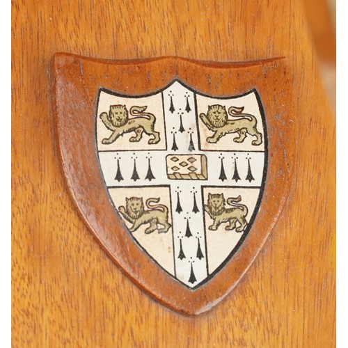 850 - Pair of rowing interest hardwood bookends with coat of arms, the largest 27cm wide