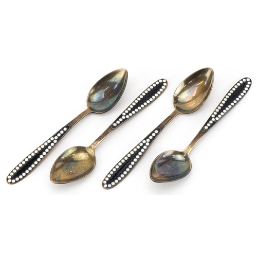 478 - Set of four Russian silver gilt and enamel teaspoons, impressed marks to the underside, 12cm in leng... 