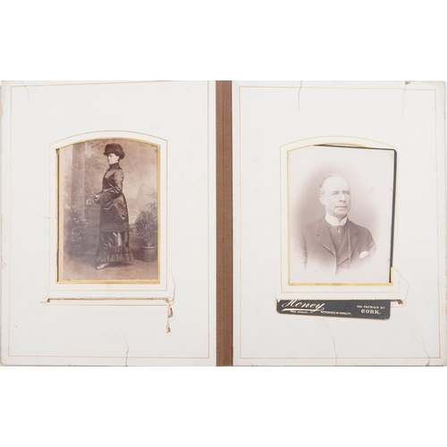 774 - Assorted photographs including Victorian cabinet cards, autograph book, postcards and silk cigarette... 