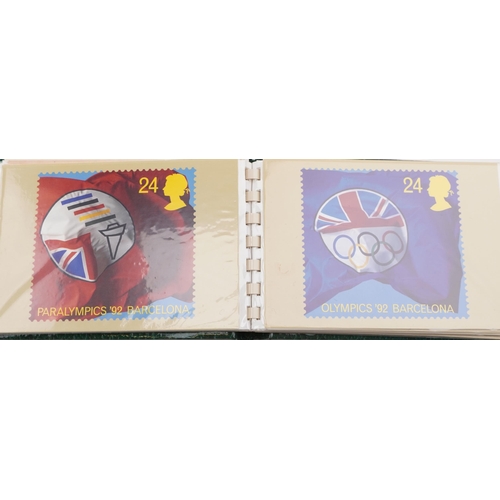 829 - Assorted ephemera including miniature children's books, postcards and Historic Cars coin set