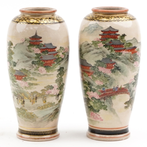 200 - Pair of Japanese Satsuma pottery vases finely decorated with landscapes, character mark to the base,... 