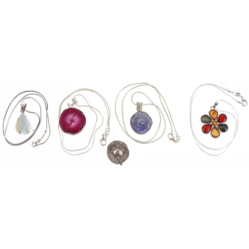 3828 - Four silver and white metal semi precious stone pendants on chains and a silver hat brooch, total we... 