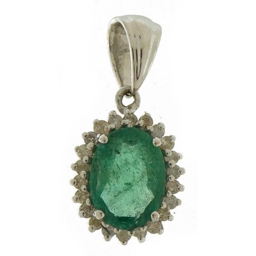 3205 - 14ct white gold emerald and diamond pendant, total emerald weight approximately 0.88 carat, total di... 