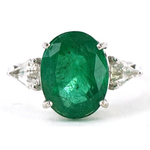 3200 - 18ct white gold oval emerald and diamond ring, total emerald weight approximately 4.45 carat, total ... 
