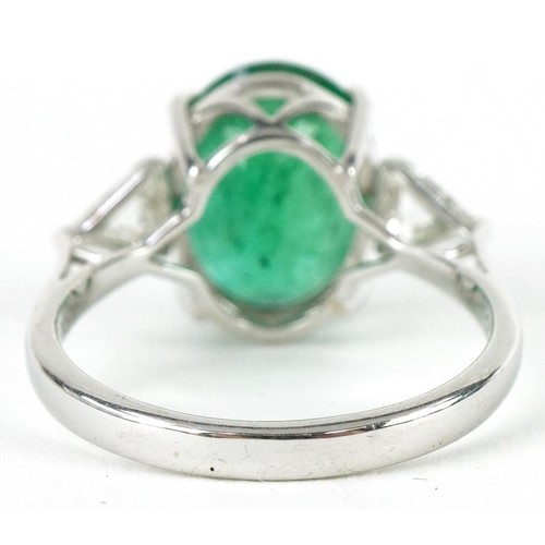 3200 - 18ct white gold oval emerald and diamond ring, total emerald weight approximately 4.45 carat, total ... 