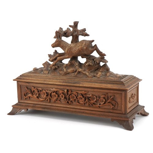 19th Century Black forest table casket with red silk button back upholstered interior finely carved with a mountain goat, 26.5cm H x 37cm W x 15cm D